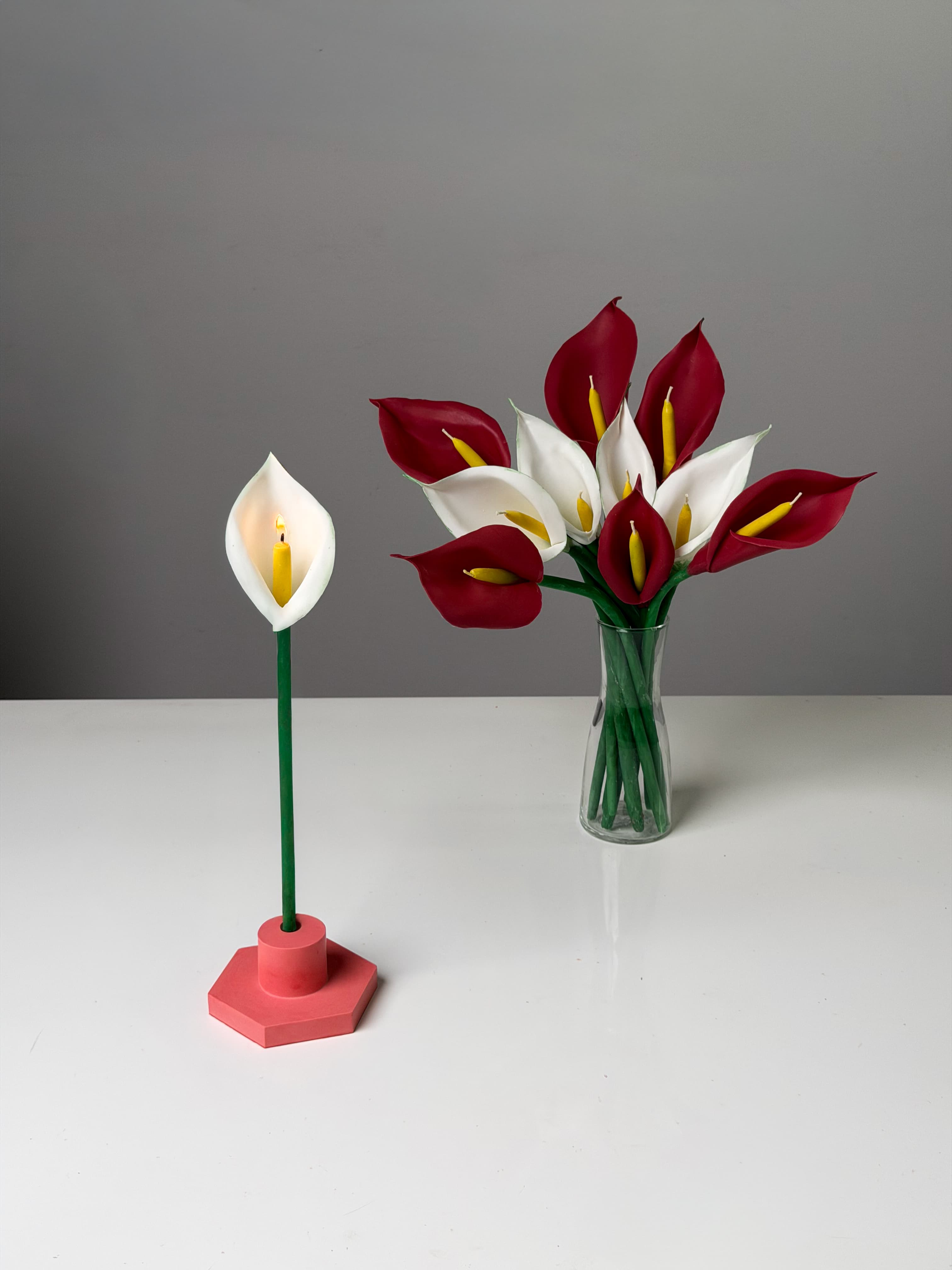 Red and white calla lily wax bouquet in a vase